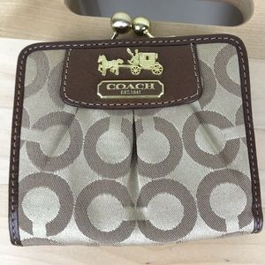 NWOT Coach bifold wallet with pink interior.